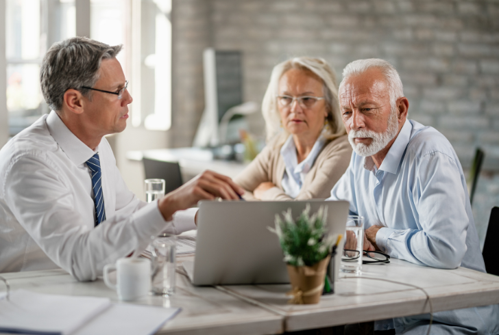 Senior patient reviews Medicare coverage information with a healthcare advisor.